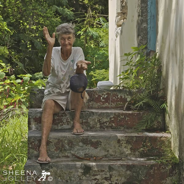 Erlene Downie outside her old house now a ruin.jpg - Erlene outside her old house